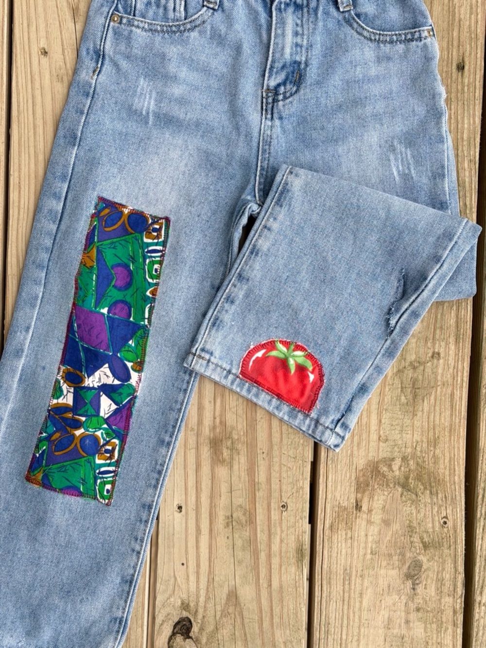 Light Wash Women’s Jeans with Colorful Patch Accents